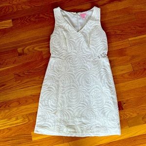 White lace Lilly Pulitzer with peek a boo panels v neck A line dress.